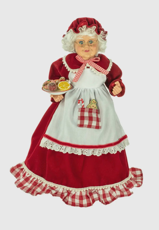 Standing Mrs Claus holding candy platter