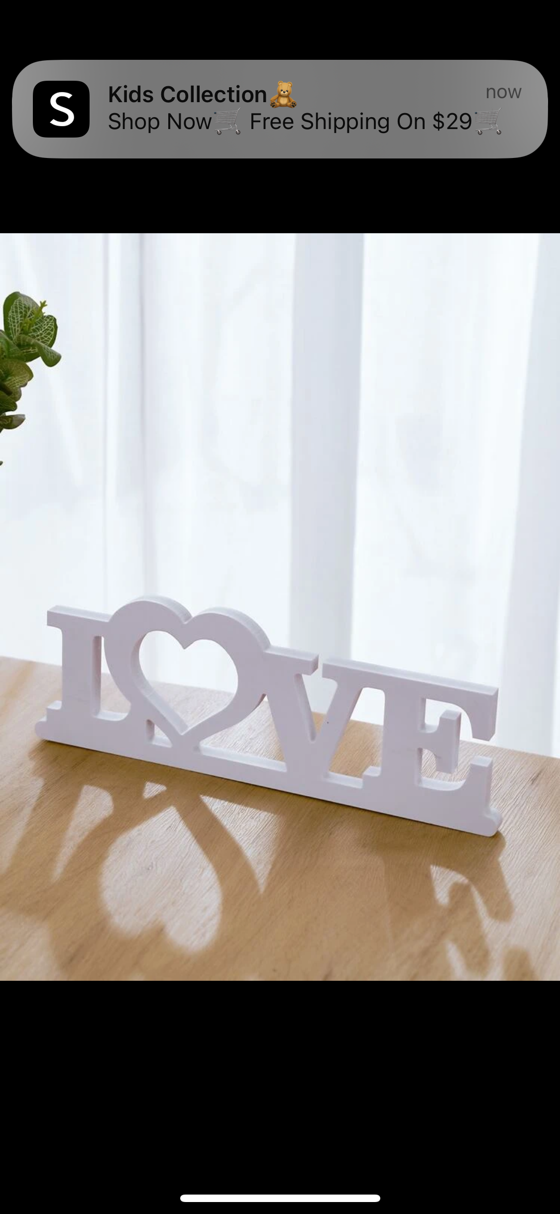 White wooden ‘LOVE’ plaque