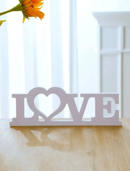 White wooden ‘LOVE’ plaque